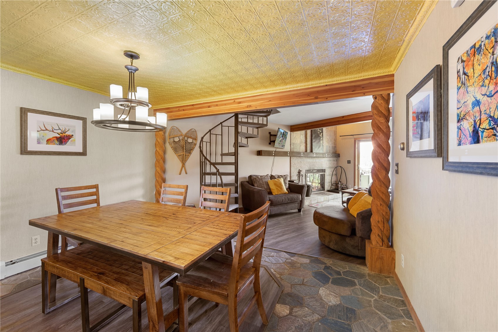 9490 Ryan Gulch Road, Unit 94202 Silverthorne, CO 80498 - Photo 13 of 50 a view of a dining room with furniture window and wooden floor