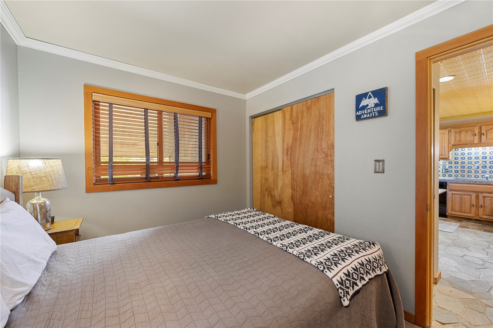 9490 Ryan Gulch Road, Unit 94202 Silverthorne, CO 80498 - Photo 14 of 50 a bedroom with a bed and a window