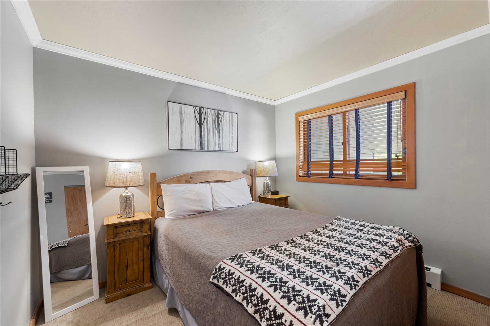 9490 Ryan Gulch Road, Unit 94202 Silverthorne, CO 80498 - Photo 15 of 50 a bedroom with a bed and a window