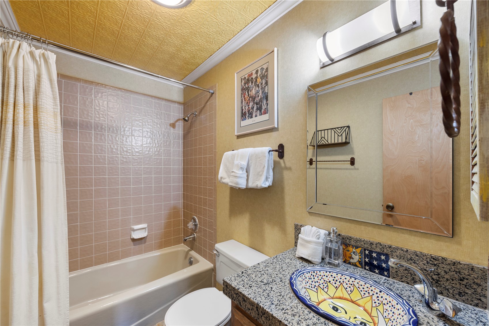 9490 Ryan Gulch Road, Unit 94202 Silverthorne, CO 80498 - Photo 17 of 50 a bathroom with a granite countertop sink and a mirror
