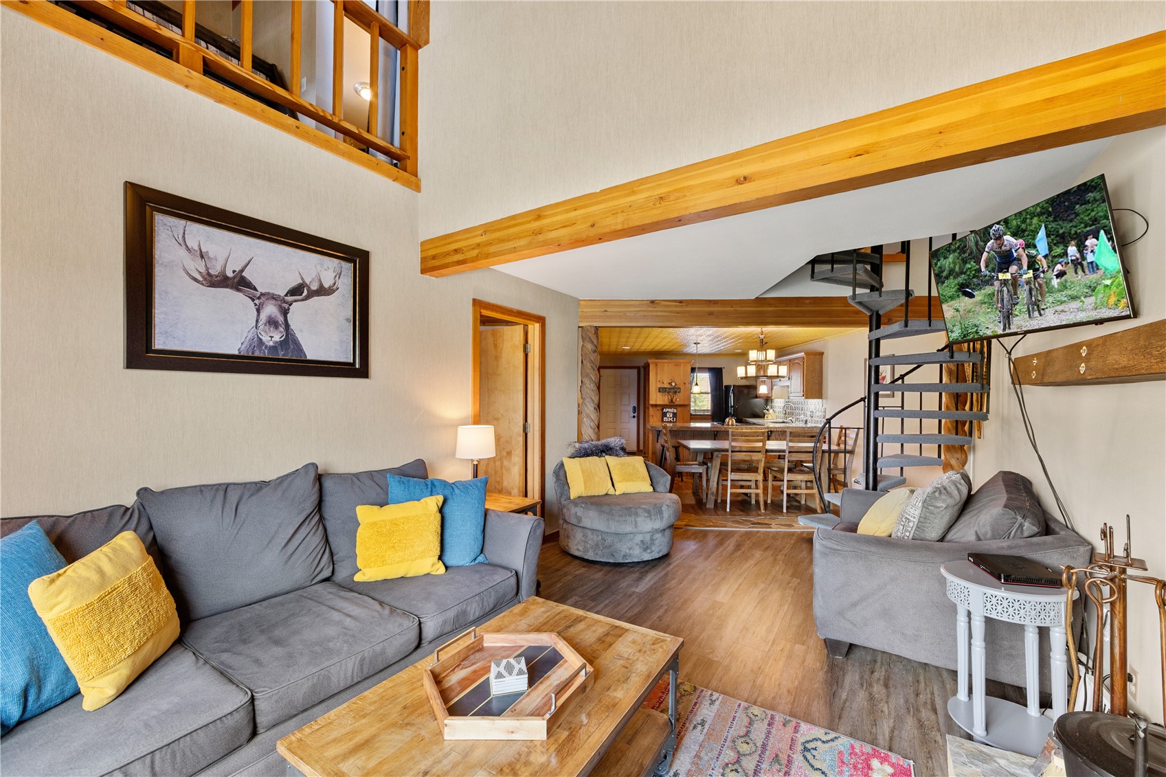 9490 Ryan Gulch Road, Unit 94202 Silverthorne, CO 80498 - Photo 20 of 50 a living room with furniture and a wooden floor