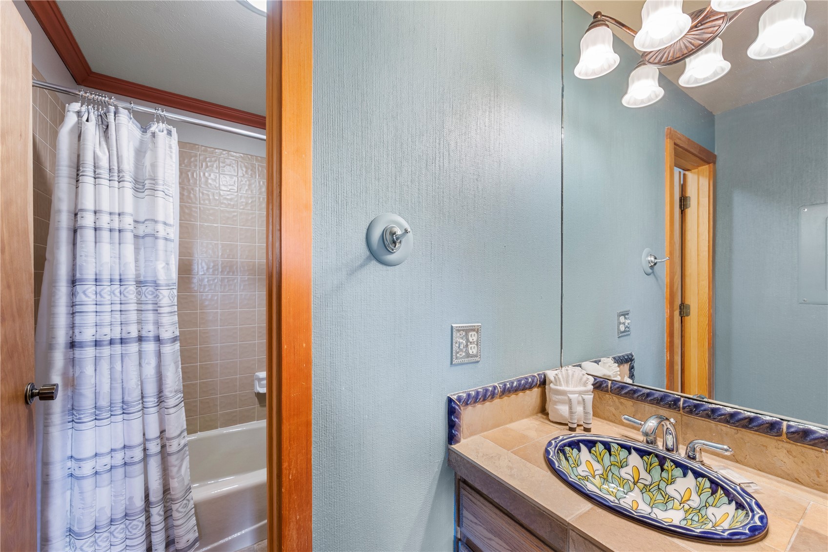 9490 Ryan Gulch Road, Unit 94202 Silverthorne, CO 80498 - Photo 24 of 50 a bathroom with a granite countertop sink and a mirror