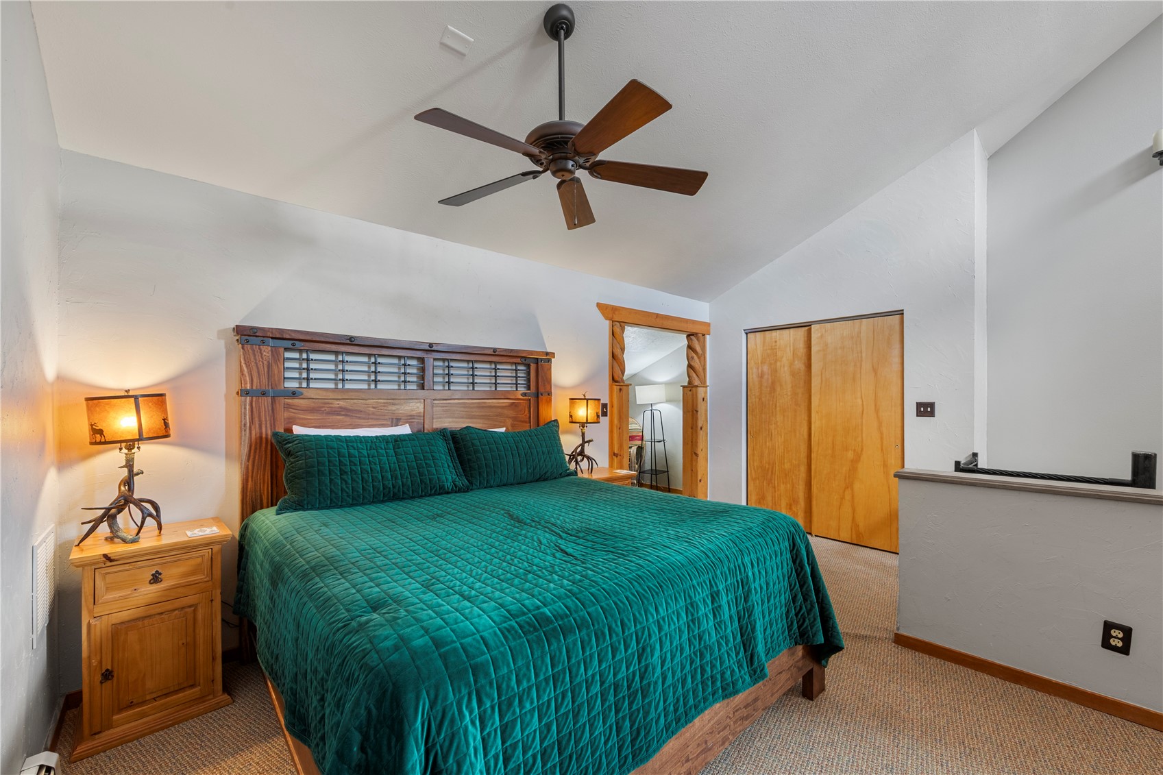 9490 Ryan Gulch Road, Unit 94202 Silverthorne, CO 80498 - Photo 26 of 50 a bedroom with a bed and a window