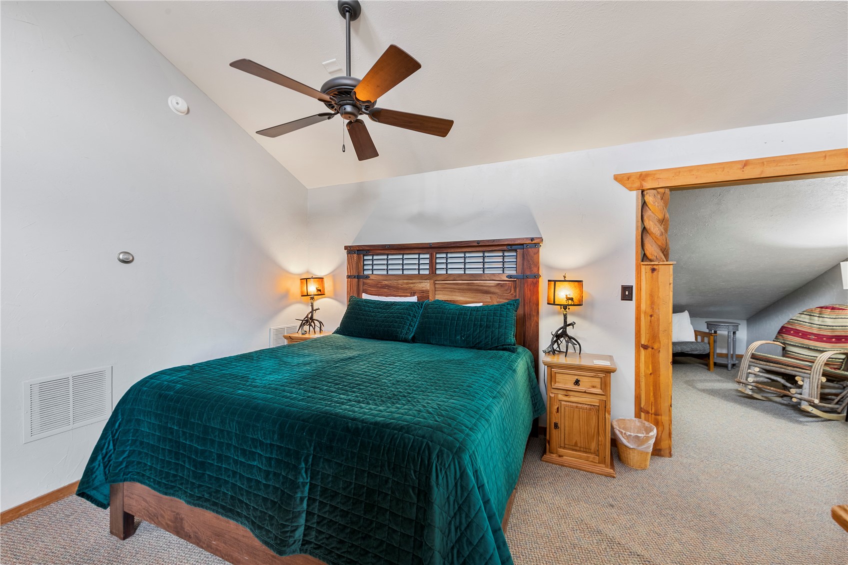 9490 Ryan Gulch Road, Unit 94202 Silverthorne, CO 80498 - Photo 27 of 50 a bedroom with a bed and a tv