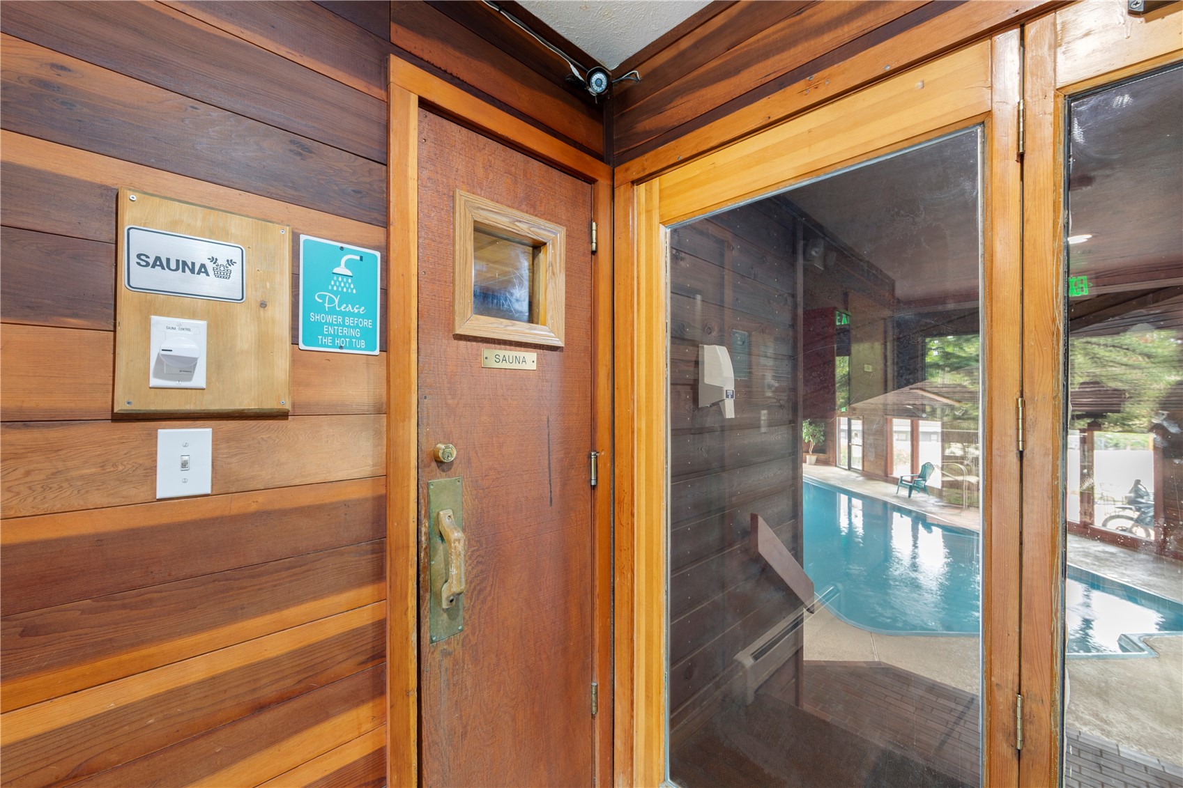 9490 Ryan Gulch Road, Unit 94202 Silverthorne, CO 80498 - Photo 40 of 50 a front view of a house with a glass door