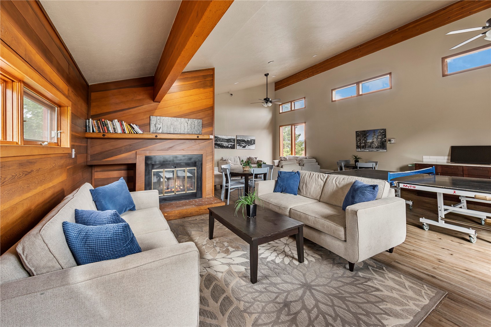 9490 Ryan Gulch Road, Unit 94202 Silverthorne, CO 80498 - Photo 48 of 50 a living room with furniture and a fireplace