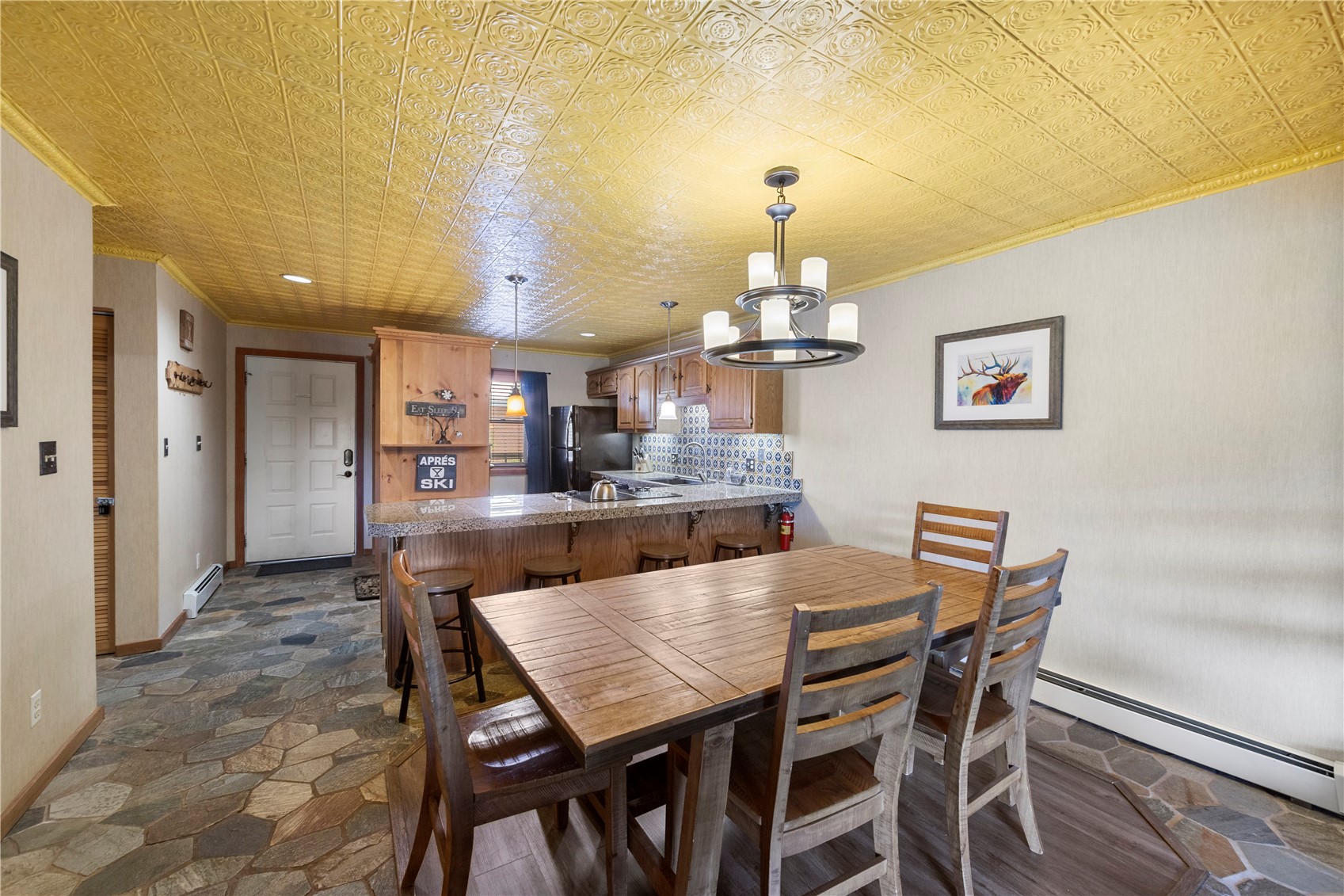 9490 Ryan Gulch Road, Unit 94202 Silverthorne, CO 80498 - Photo 8 of 50 a view of a dining room with furniture