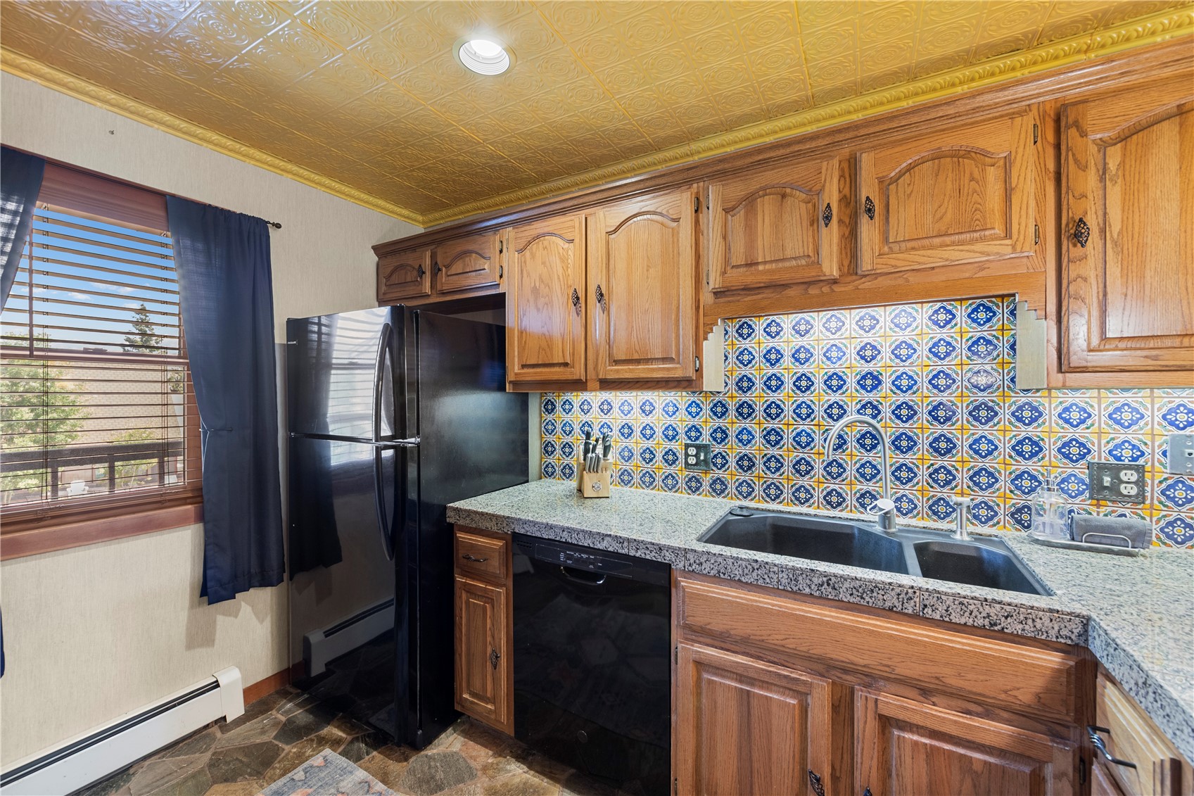9490 Ryan Gulch Road, Unit 94202 Silverthorne, CO 80498 - Photo 10 of 50 a kitchen with stainless steel appliances granite countertop a sink stove and refrigerator