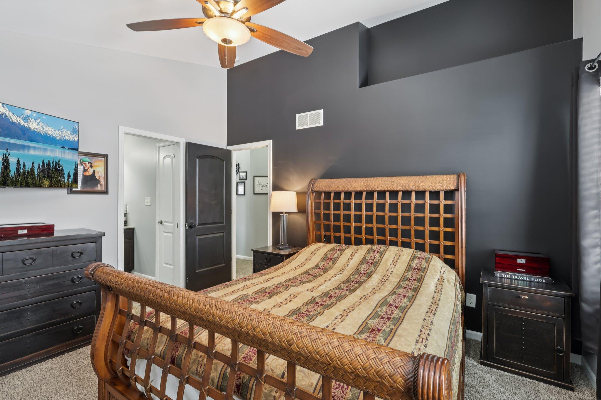 2235 Coldspring Road Crown Point, IN 46307 - Photo 30 of 51 a bedroom with a bed and a chandelier