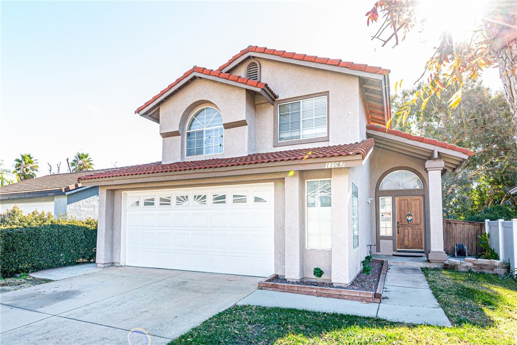 11067 Malone Street Rancho Cucamonga, CA 91701 - Photo 1 of 1 a front view of a house with a yard and outdoor seating