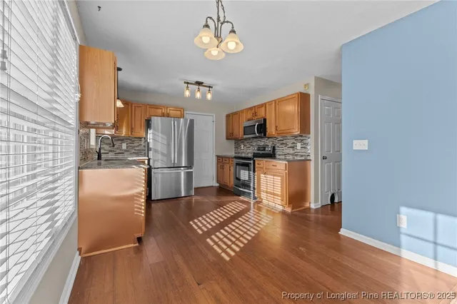 a kitchen with a refrigerator a sink and dishwasher