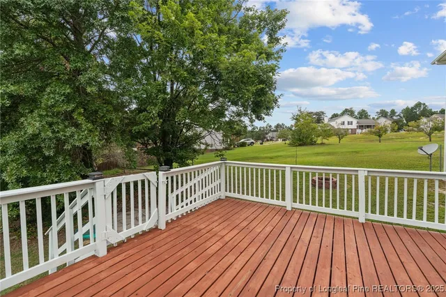 a view of a chair and table on the garden