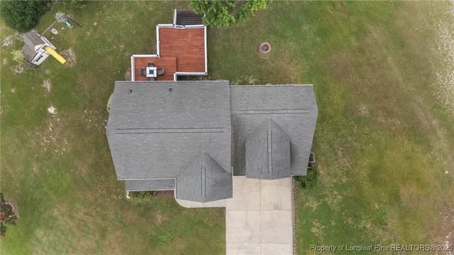 a front view of a house with a garden and porch