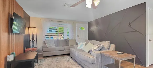 a living room with furniture and a large window