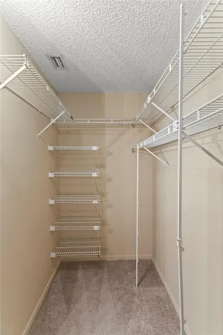 a view of an empty walk in closet
