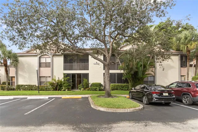 a view of a parked cars in front of a building