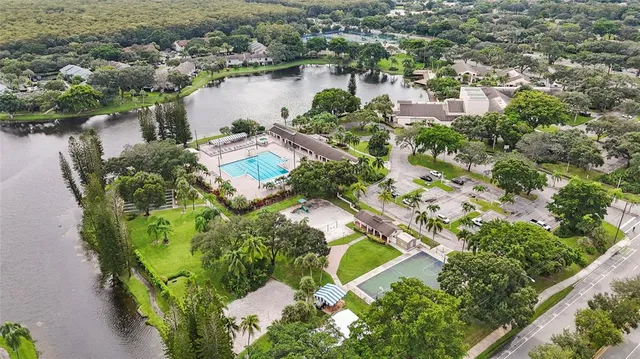 an aerial view of a house with a lake view