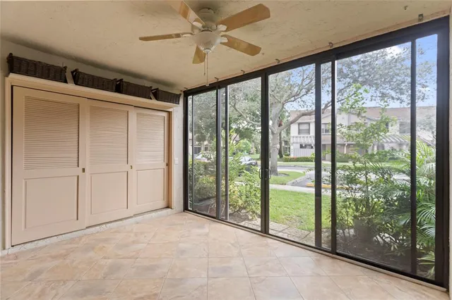 a view of empty room with ceiling fan