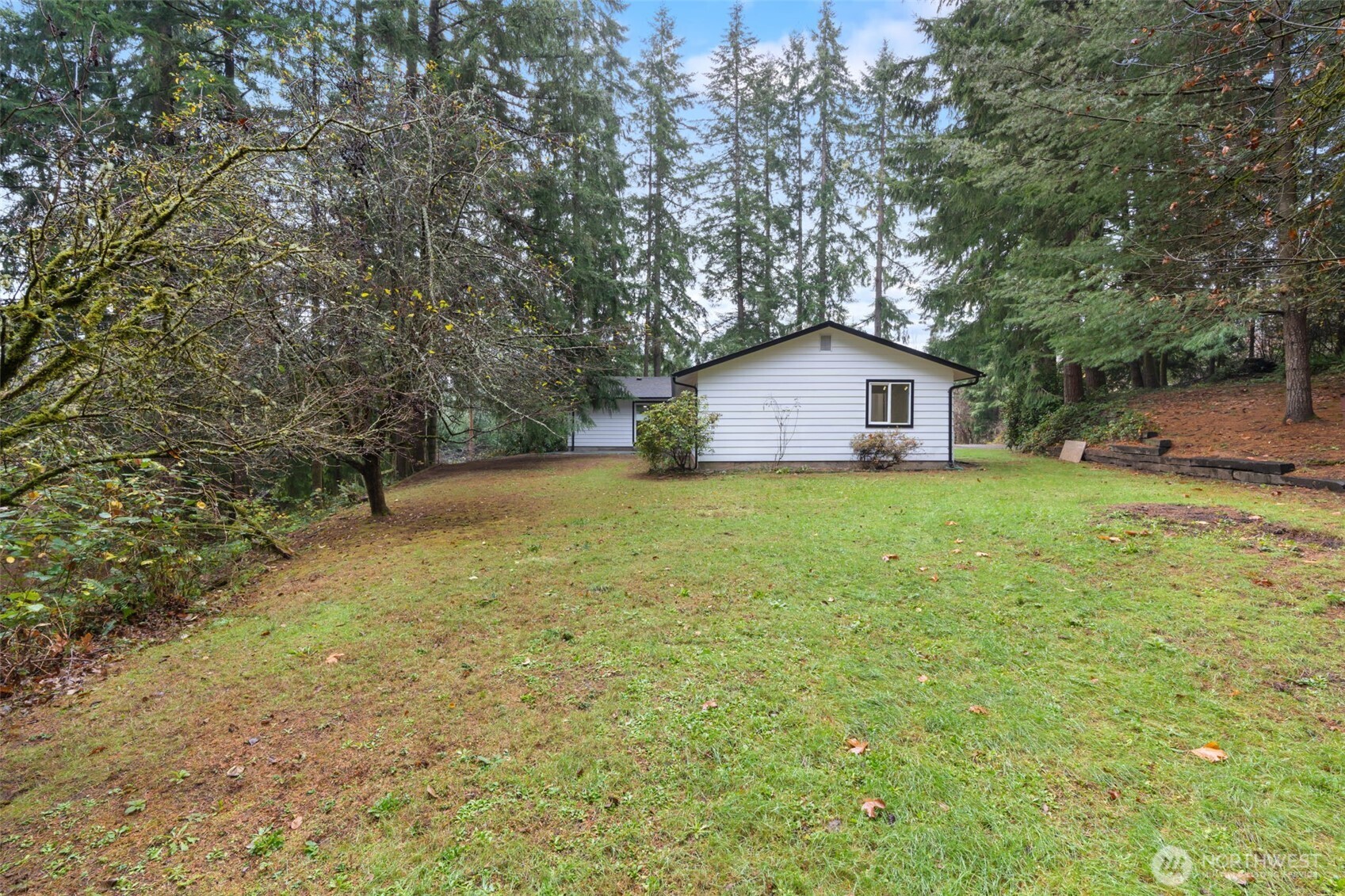 400 Ogden Road Castle Rock, WA 98611 - Photo 23 of 30 a view of a house with a yard