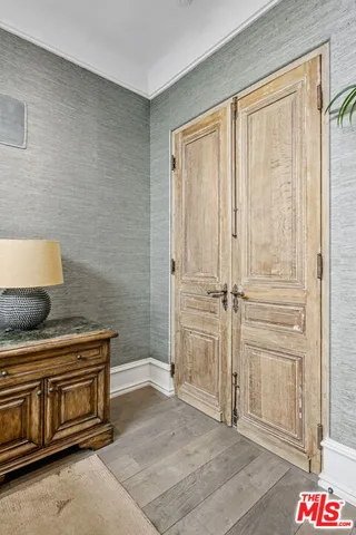 a bathroom with a double vanity sink toilet and a mirror