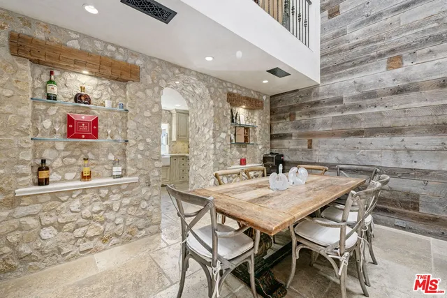 a view of a dining room with furniture and a potted plant