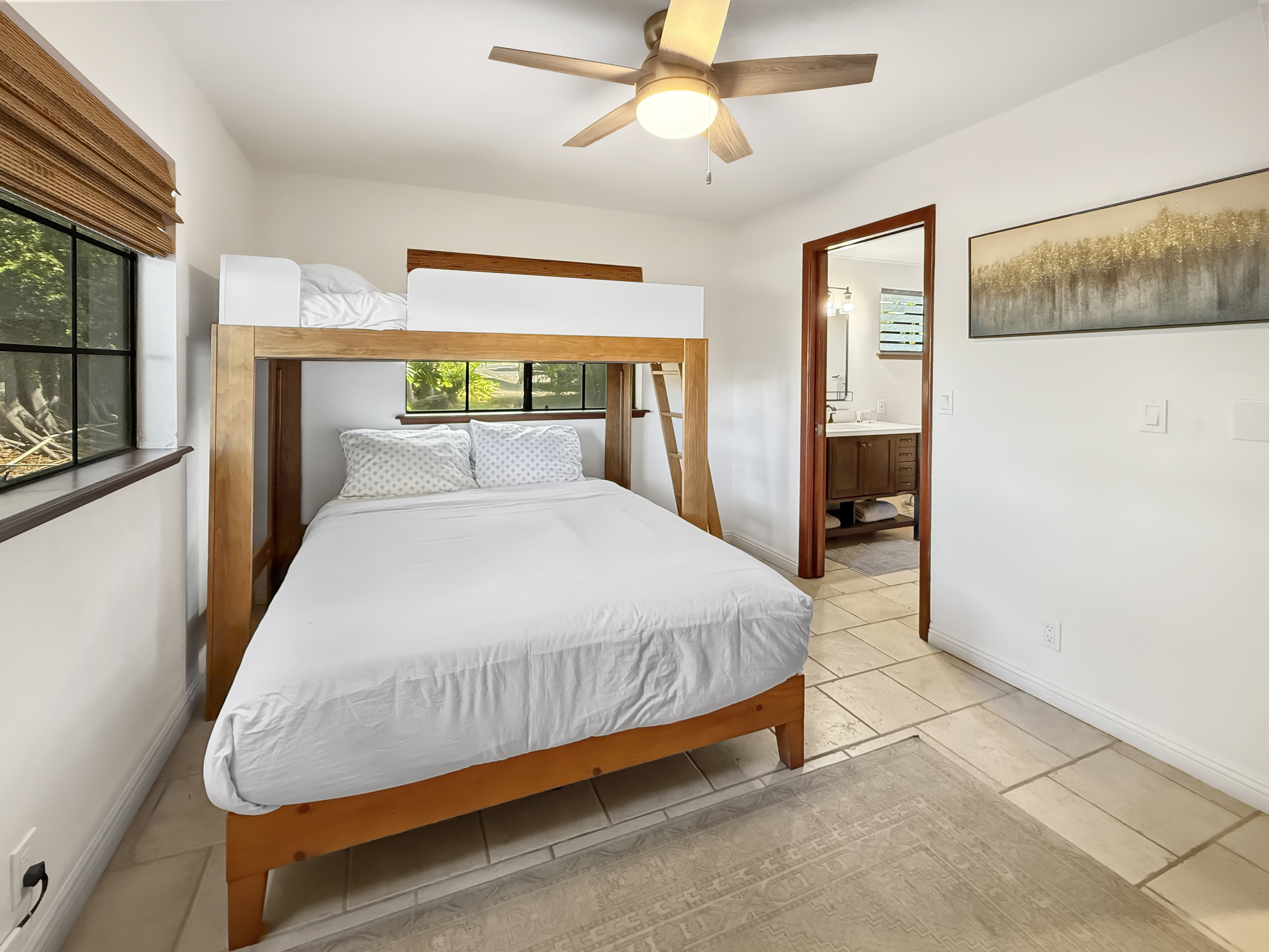 75-123 Lunapule Road, Unit 104 Kailua-Kona, HI 96740 - Photo 23 of 30 a bed sitting in a bedroom next to a window
