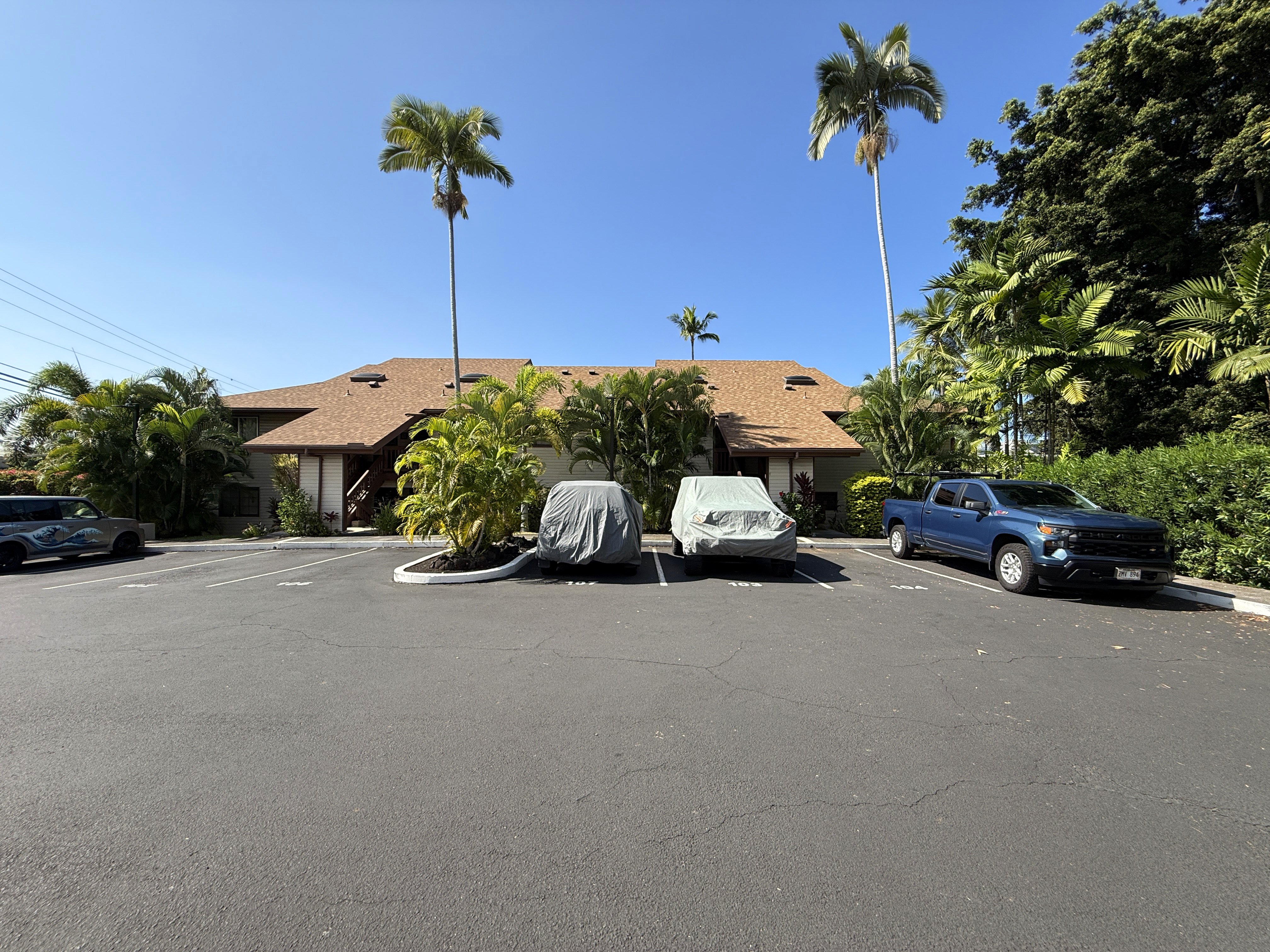 75-123 Lunapule Road, Unit 104 Kailua-Kona, HI 96740 - Photo 27 of 30 a car parked on the side of the road