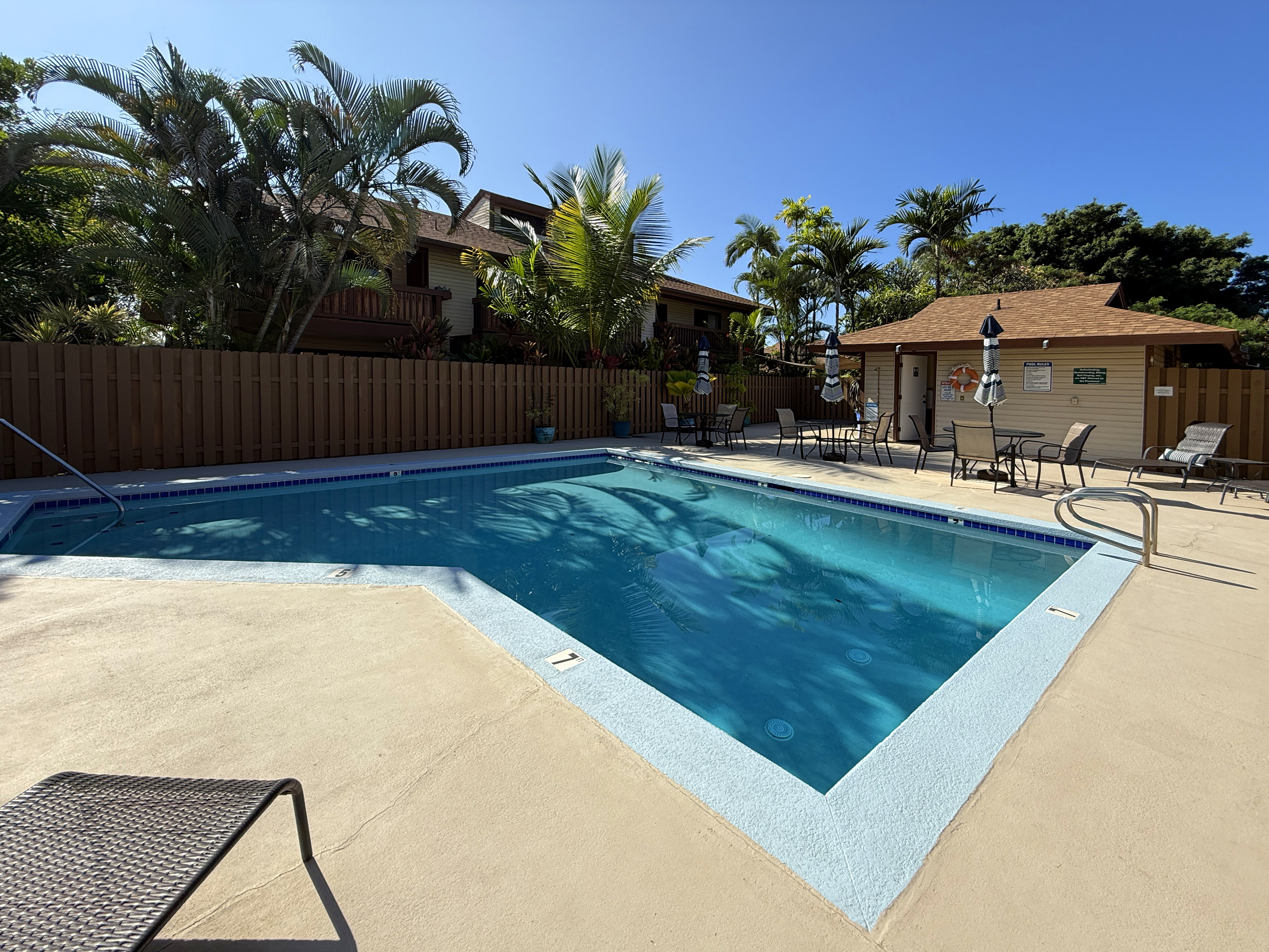 75-123 Lunapule Road, Unit 104 Kailua-Kona, HI 96740 - Photo 28 of 30 a view of a backyard with plants and a patio