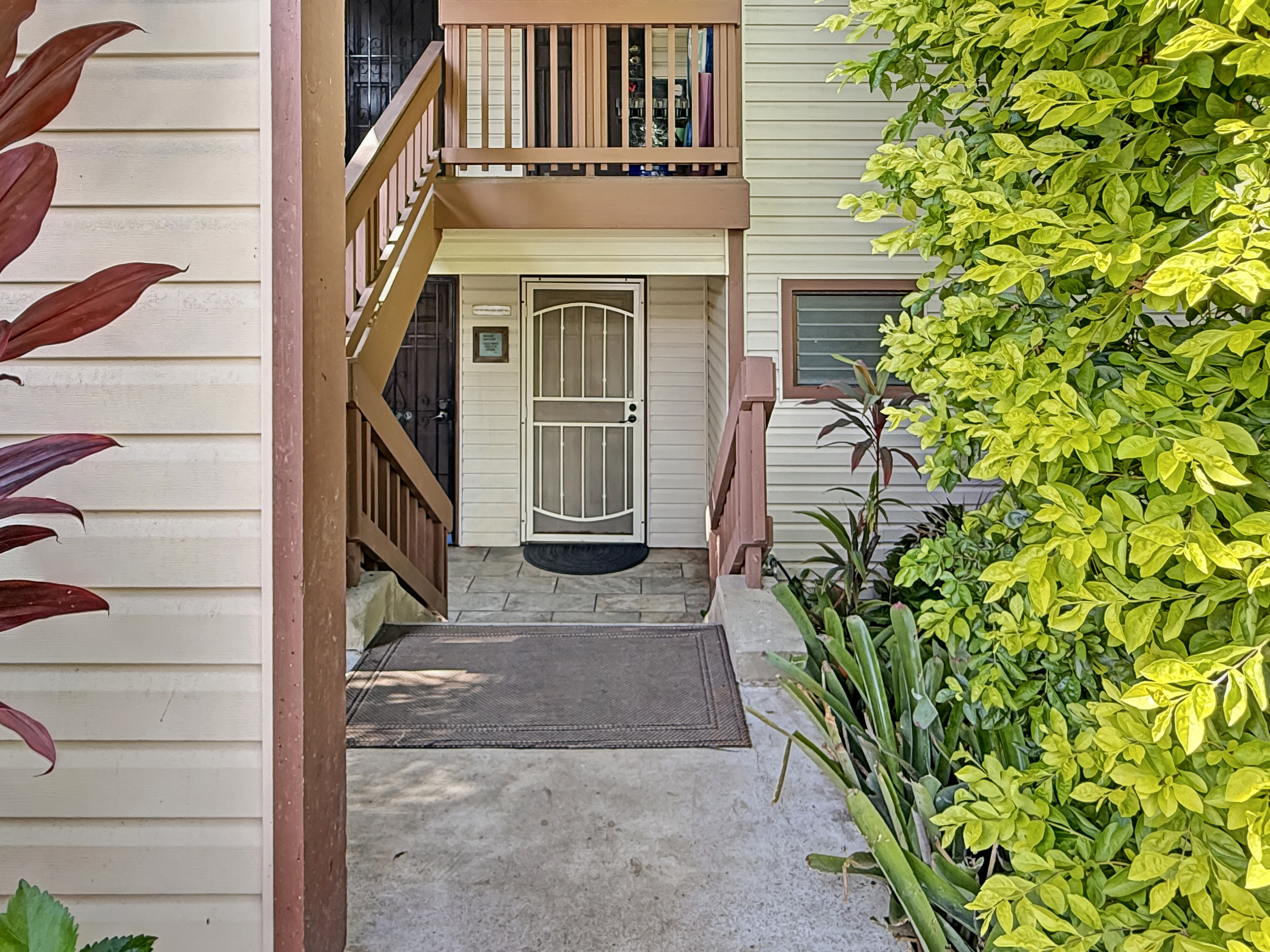 75-123 Lunapule Road, Unit 104 Kailua-Kona, HI 96740 - Photo 5 of 30 a view of a house with a door and pathway