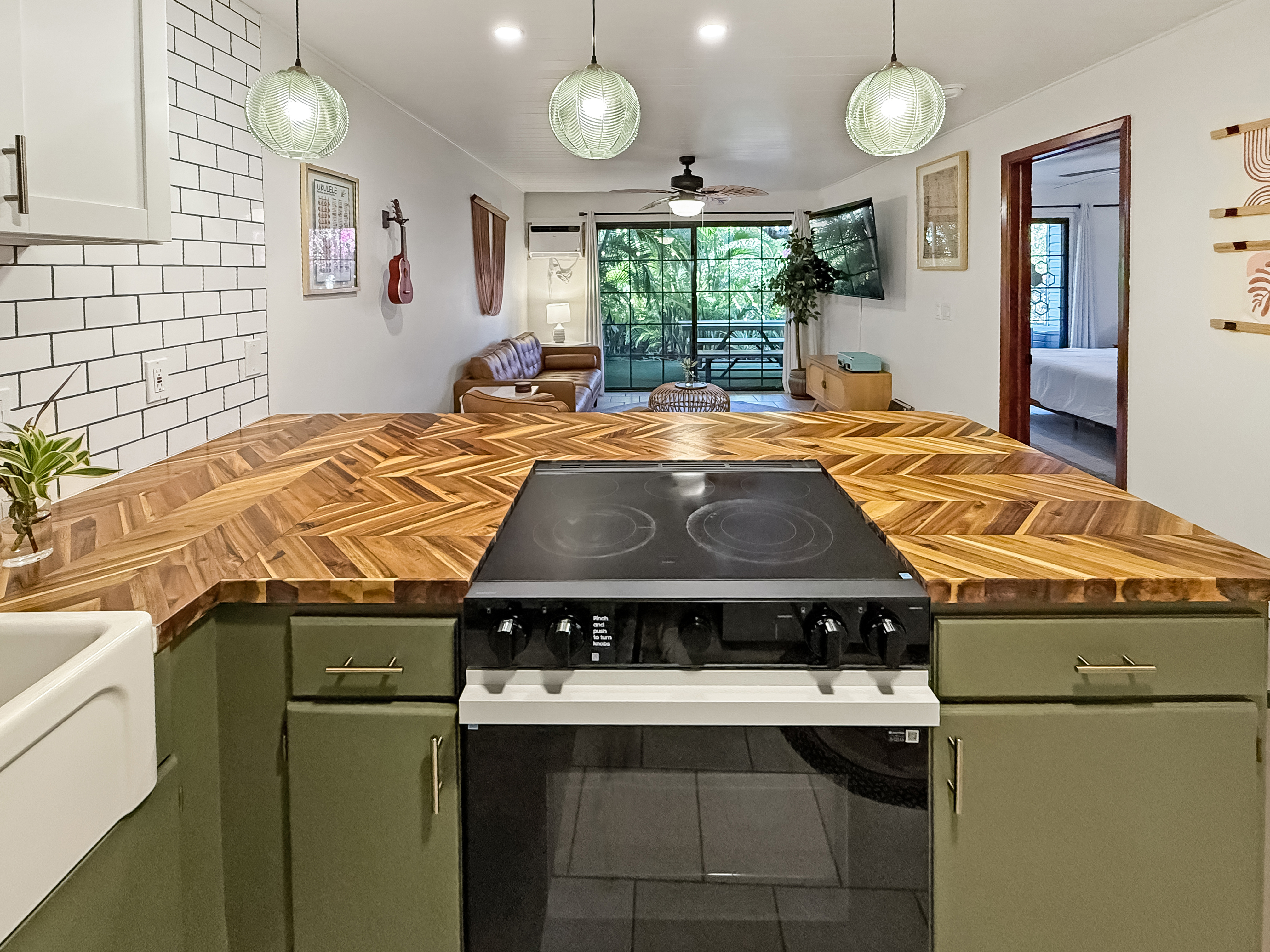 75-123 Lunapule Road, Unit 104 Kailua-Kona, HI 96740 - Photo 8 of 30 a kitchen with a stove and a sink