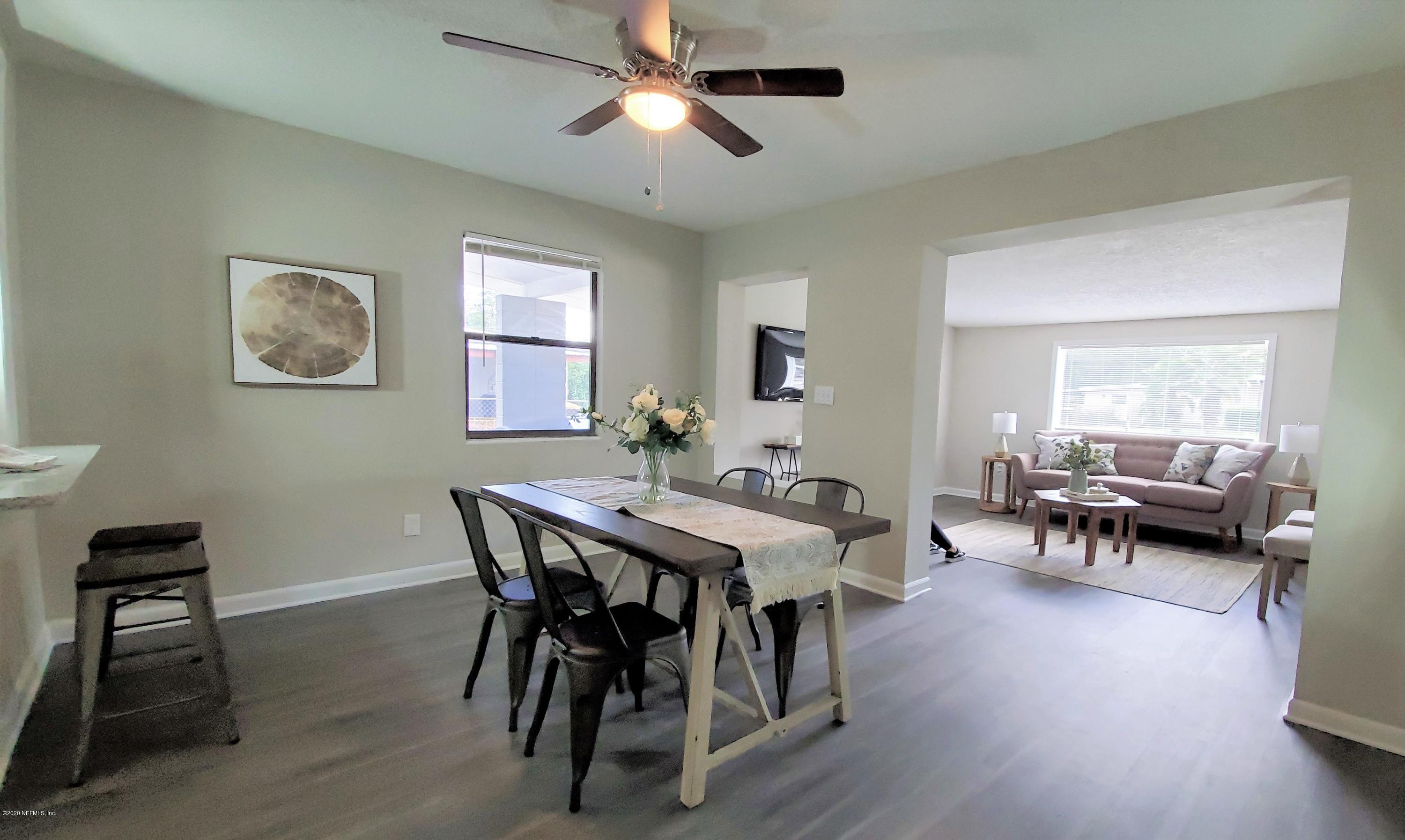 6929 Arques Road Jacksonville, FL 32205 - Photo 5 of 31 a view of a dining room with furniture and wooden floor