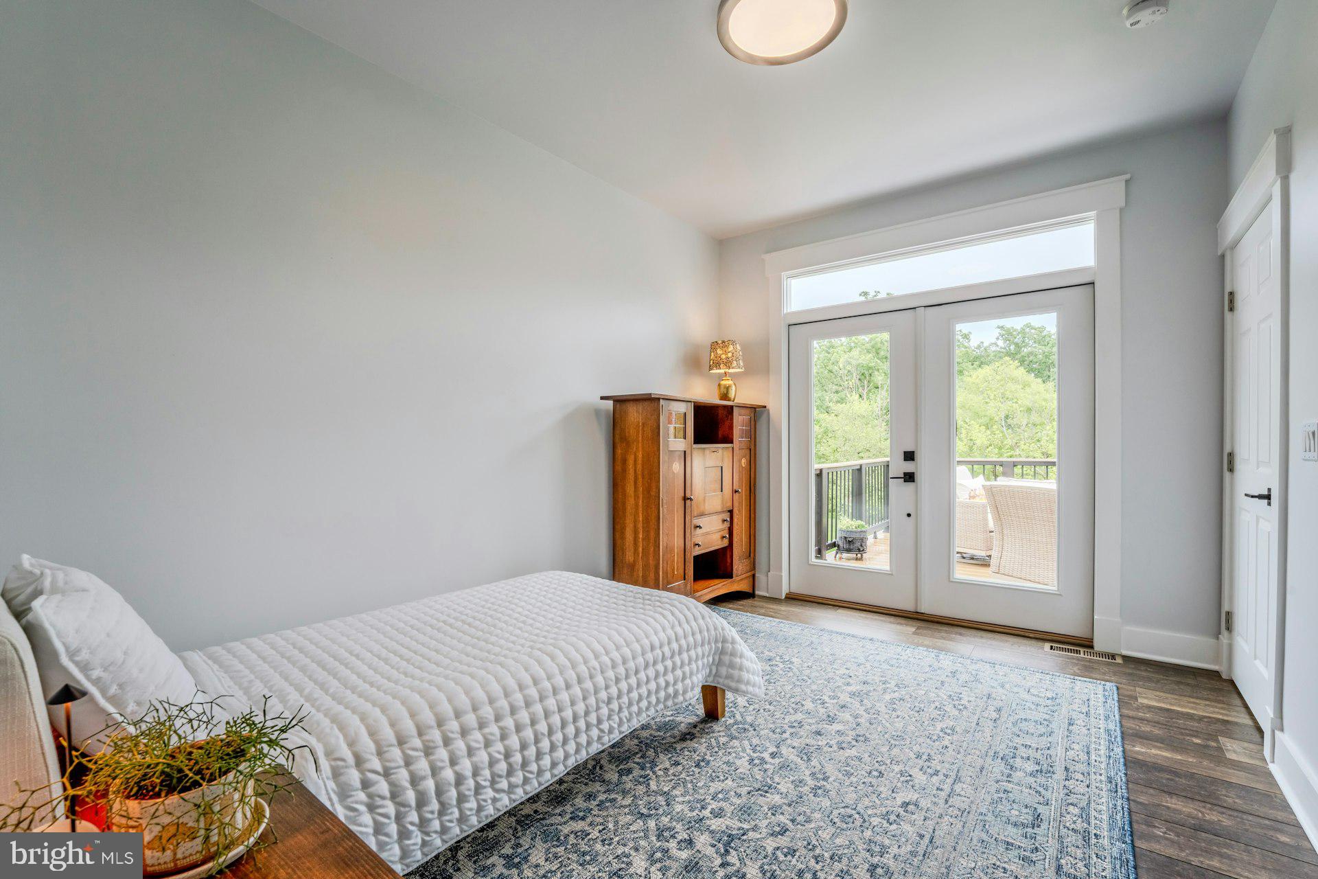 18120 Ridgewood Place Round Hill, VA 20141 - Photo 13 of 46 a bedroom with a bed and window