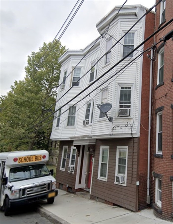 18 Marlborough Street, Unit 2L Chelsea, MA 02150 - Photo 7 of 7 a car parked in front of a building