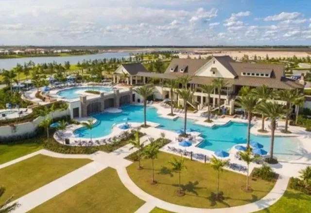 a view of a swimming pool with an ocean view