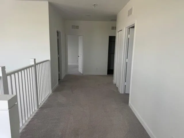 a view of a hallway with closet area