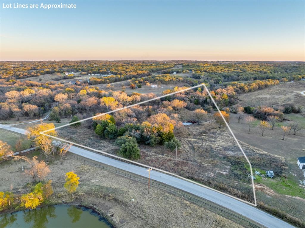 1874 County Road 3676 Springtown, TX 76082 - Photo 10 of 14 an aerial view of a house with a yard