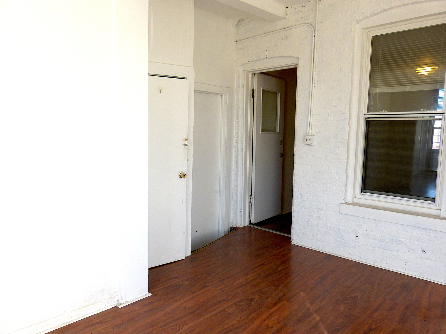 1617 West 38th Place Chicago, IL 60609 - Photo 14 of 18 a view of a hallway with wooden floor