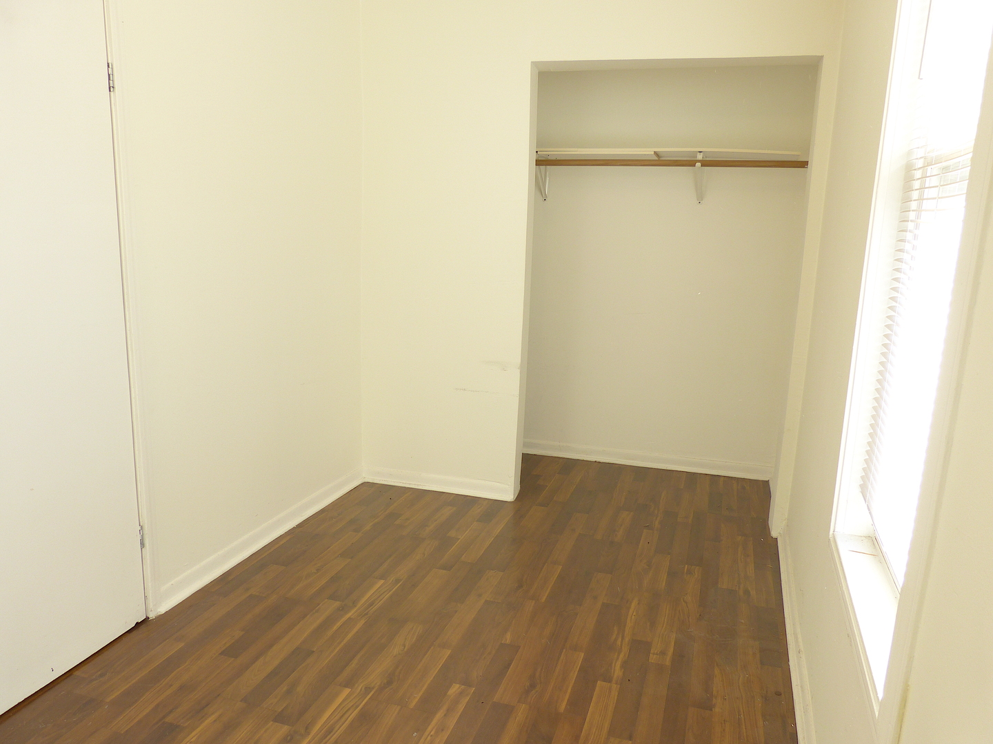 1617 West 38th Place Chicago, IL 60609 - Photo 8 of 18 a view of an empty room with wooden floor