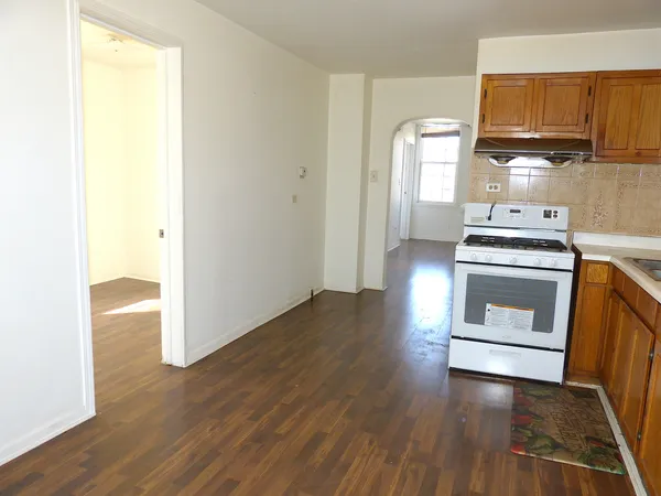 a kitchen with a sink and a stove top oven
