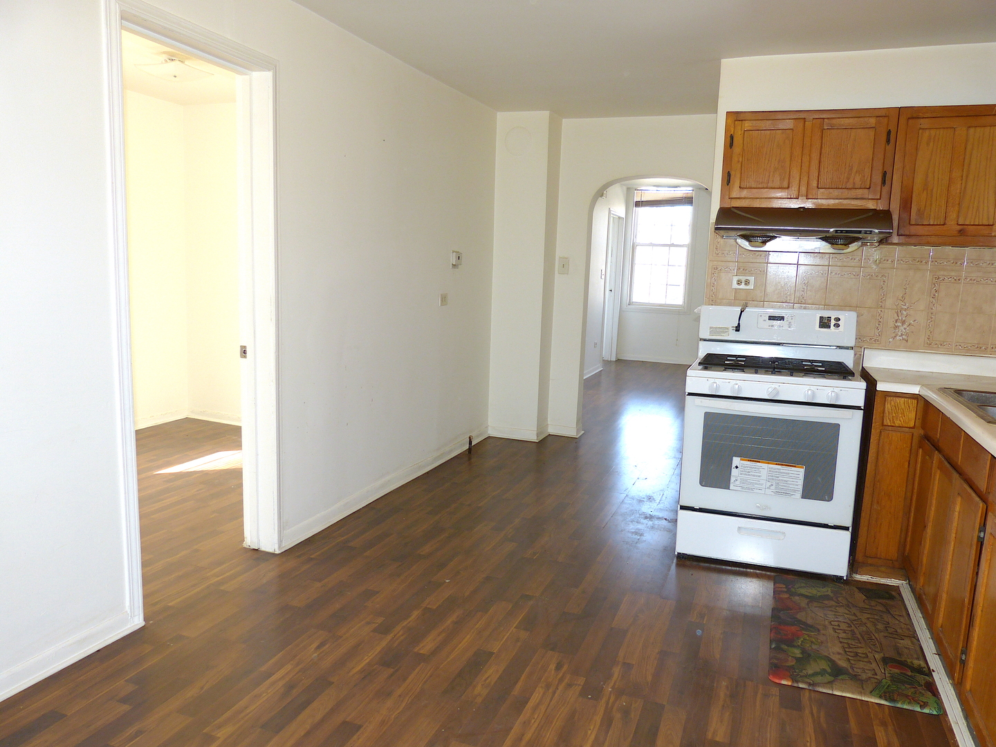 1617 West 38th Place Chicago, IL 60609 - Photo 10 of 18 a kitchen with a sink and a stove top oven