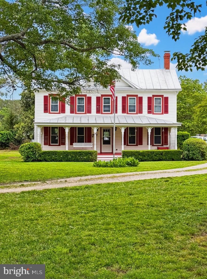 a front view of a residential apartment building with a yard