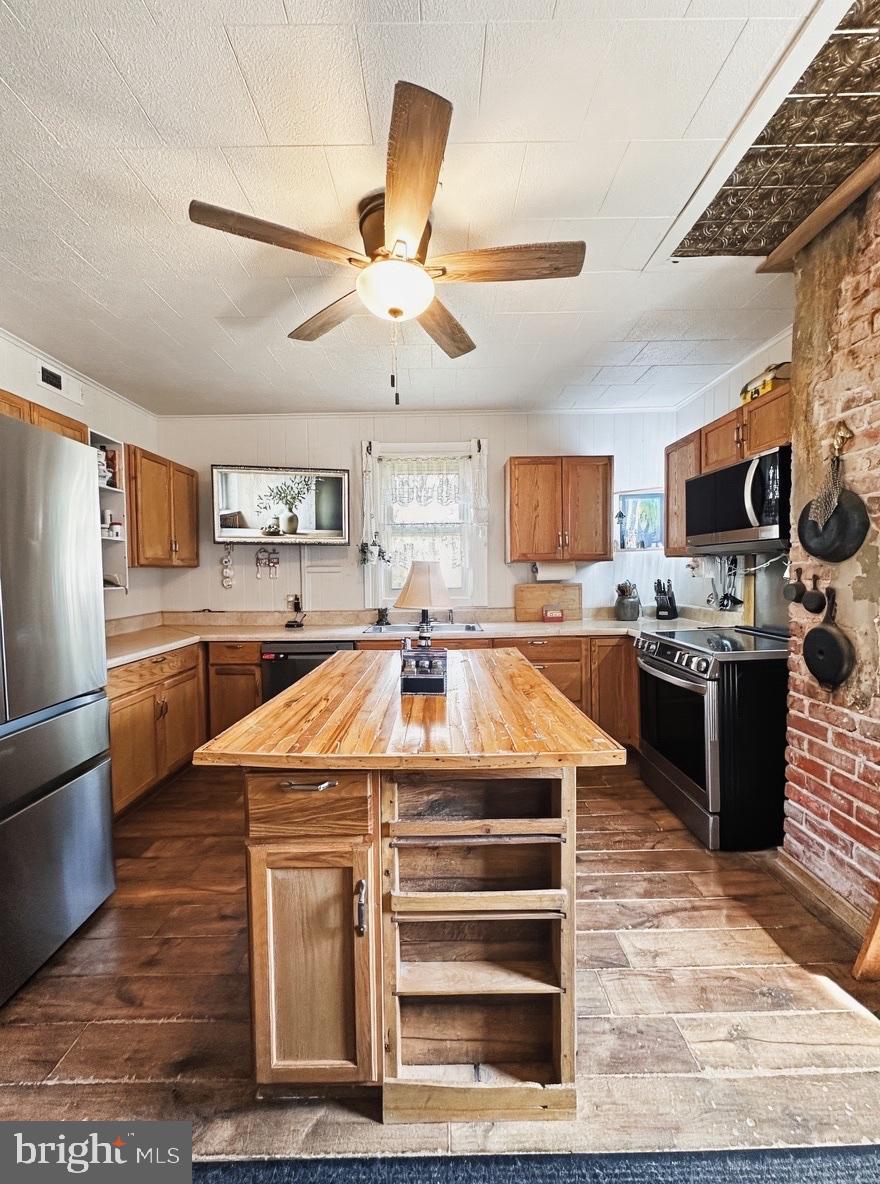 36 Martin Diggs Way Onemo, VA 23130 - Photo 12 of 64 a kitchen with a refrigerator a stove top oven a sink dishwasher and white cabinets with wooden floor