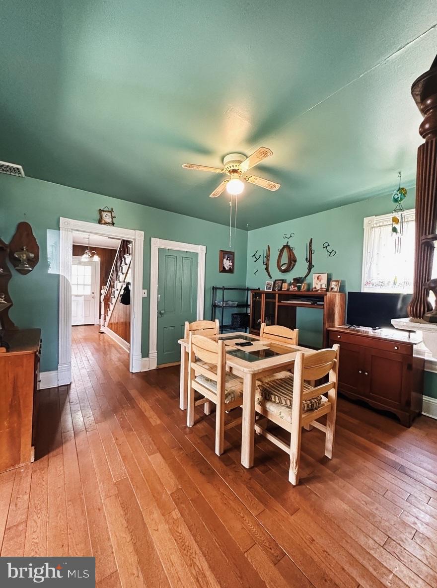 36 Martin Diggs Way Onemo, VA 23130 - Photo 14 of 64 a living room with furniture a dining table wooden floor and a fireplace