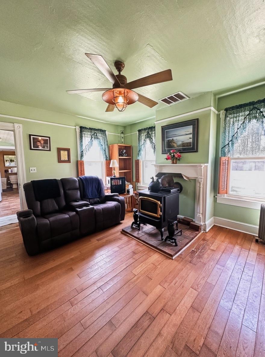 36 Martin Diggs Way Onemo, VA 23130 - Photo 22 of 64 a living room with furniture a flat screen tv and a floor to ceiling window