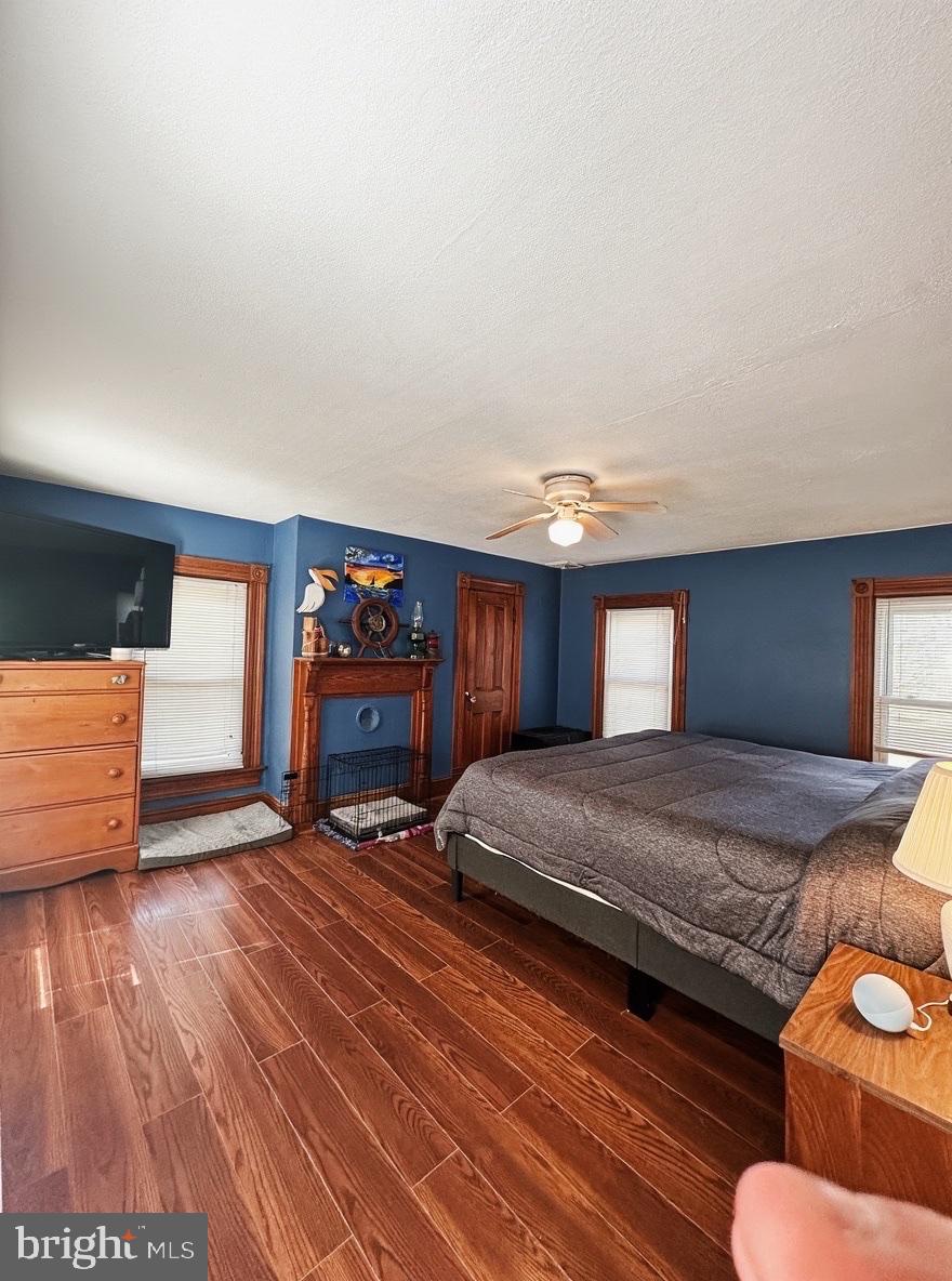 36 Martin Diggs Way Onemo, VA 23130 - Photo 29 of 64 a spacious bedroom with a bed and wooden floor