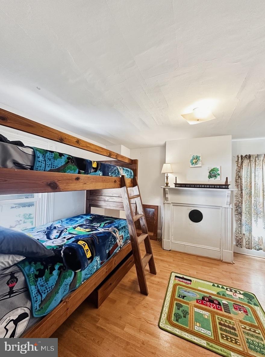 36 Martin Diggs Way Onemo, VA 23130 - Photo 34 of 64 a bedroom with furniture and a wooden floor