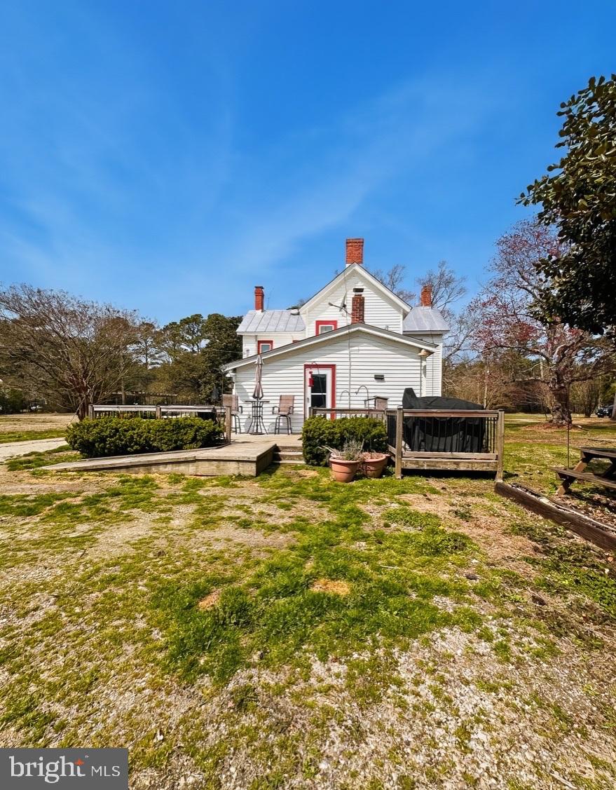 36 Martin Diggs Way Onemo, VA 23130 - Photo 39 of 64 a view of a large pool with lawn chairs under an umbrella