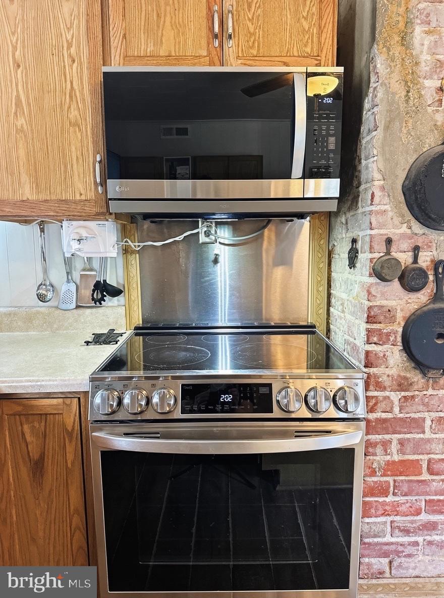 36 Martin Diggs Way Onemo, VA 23130 - Photo 9 of 64 a stove top oven sitting inside of a kitchen