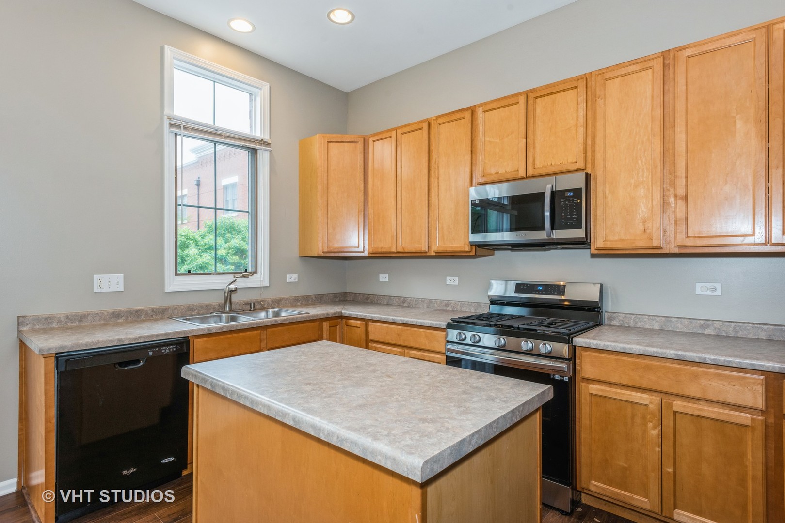 224 Lake Street Elgin, IL 60120 - Photo 13 of 20 a kitchen with stainless steel appliances granite countertop a sink stove and microwave