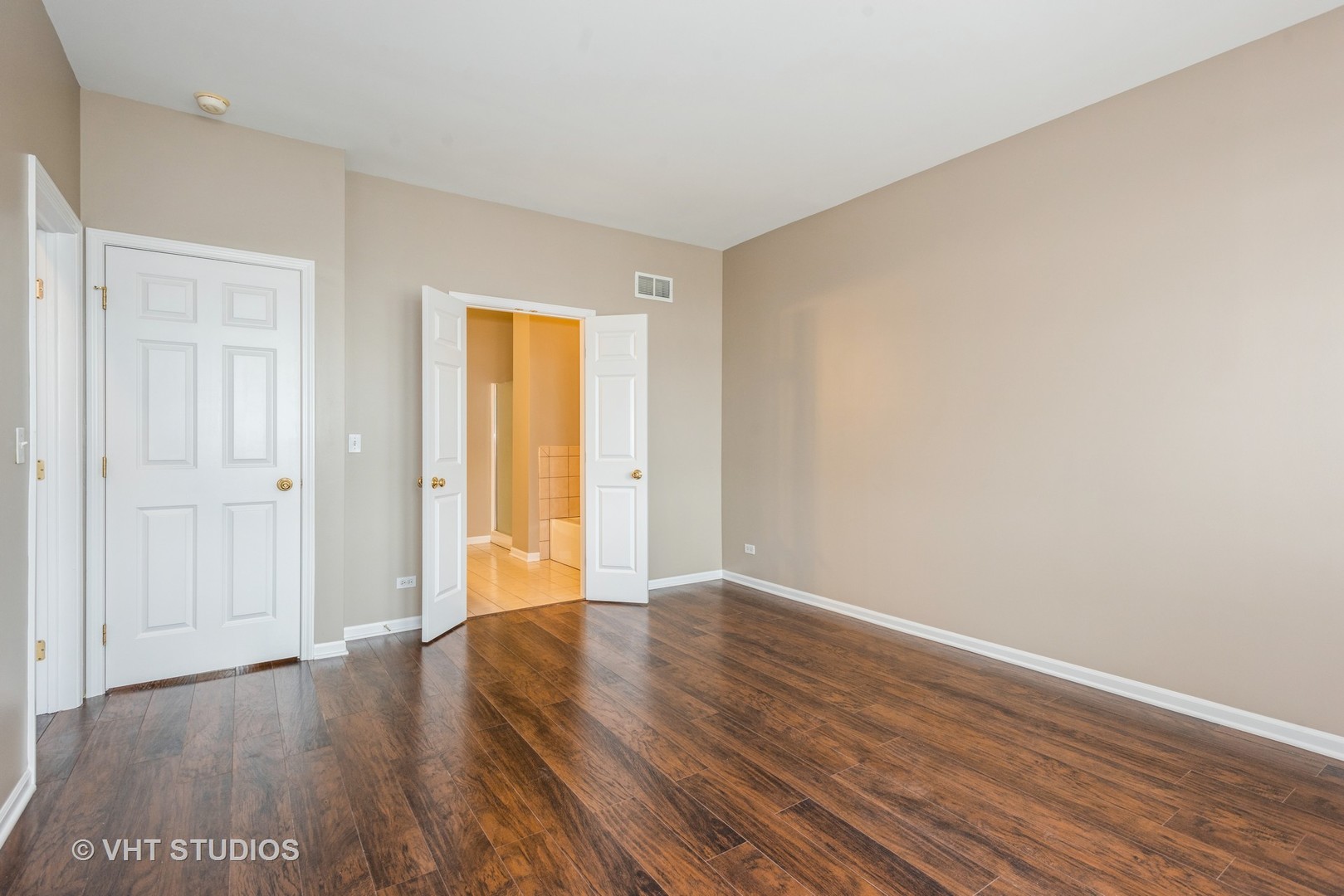 224 Lake Street Elgin, IL 60120 - Photo 10 of 20 a view of an empty room with wooden floor